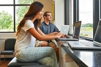 Persons using laptops