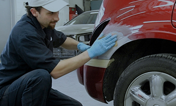 Person fixing car